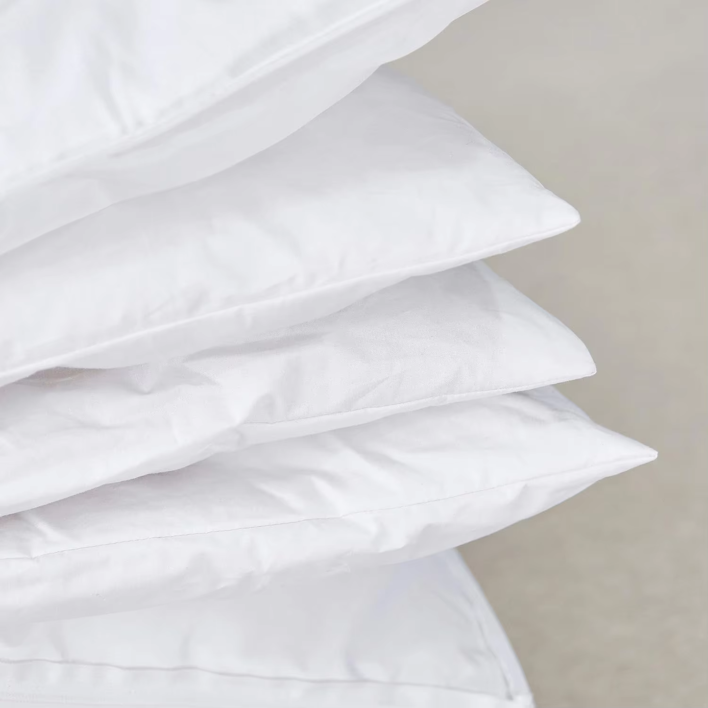Stacked pillow layers showing adjustable inserts
